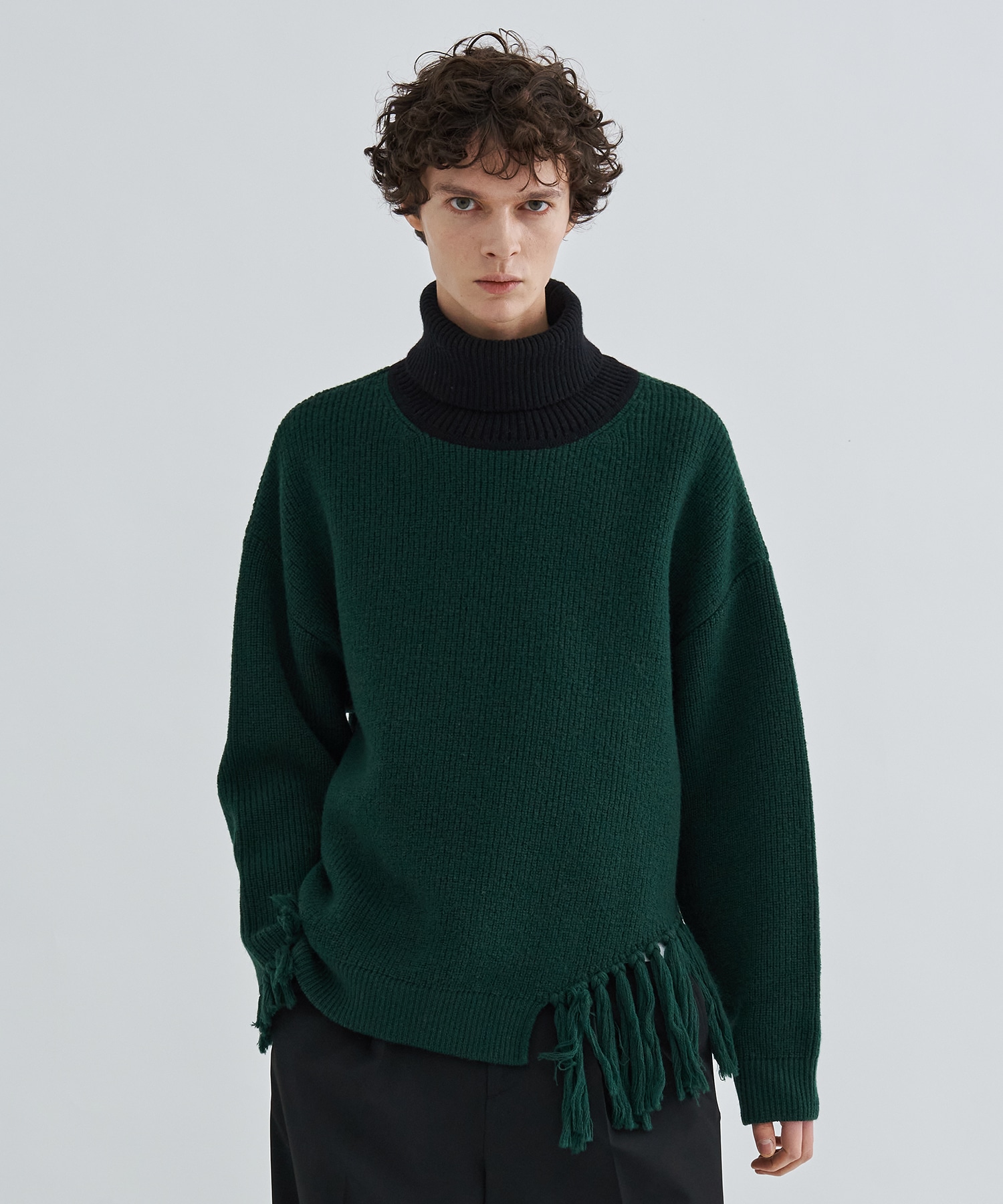 Asymmetrical Fringe Turtleneck Knit