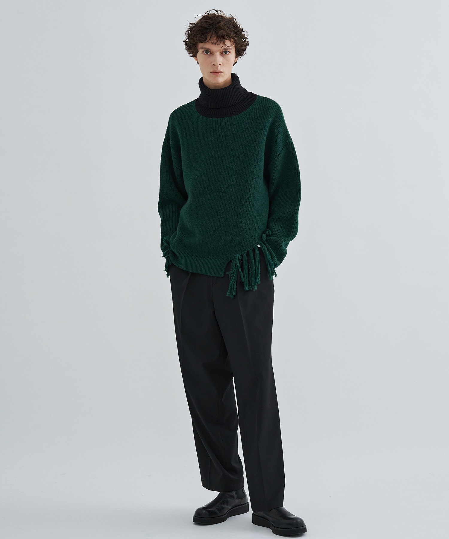 Asymmetrical Fringe Turtleneck Knit