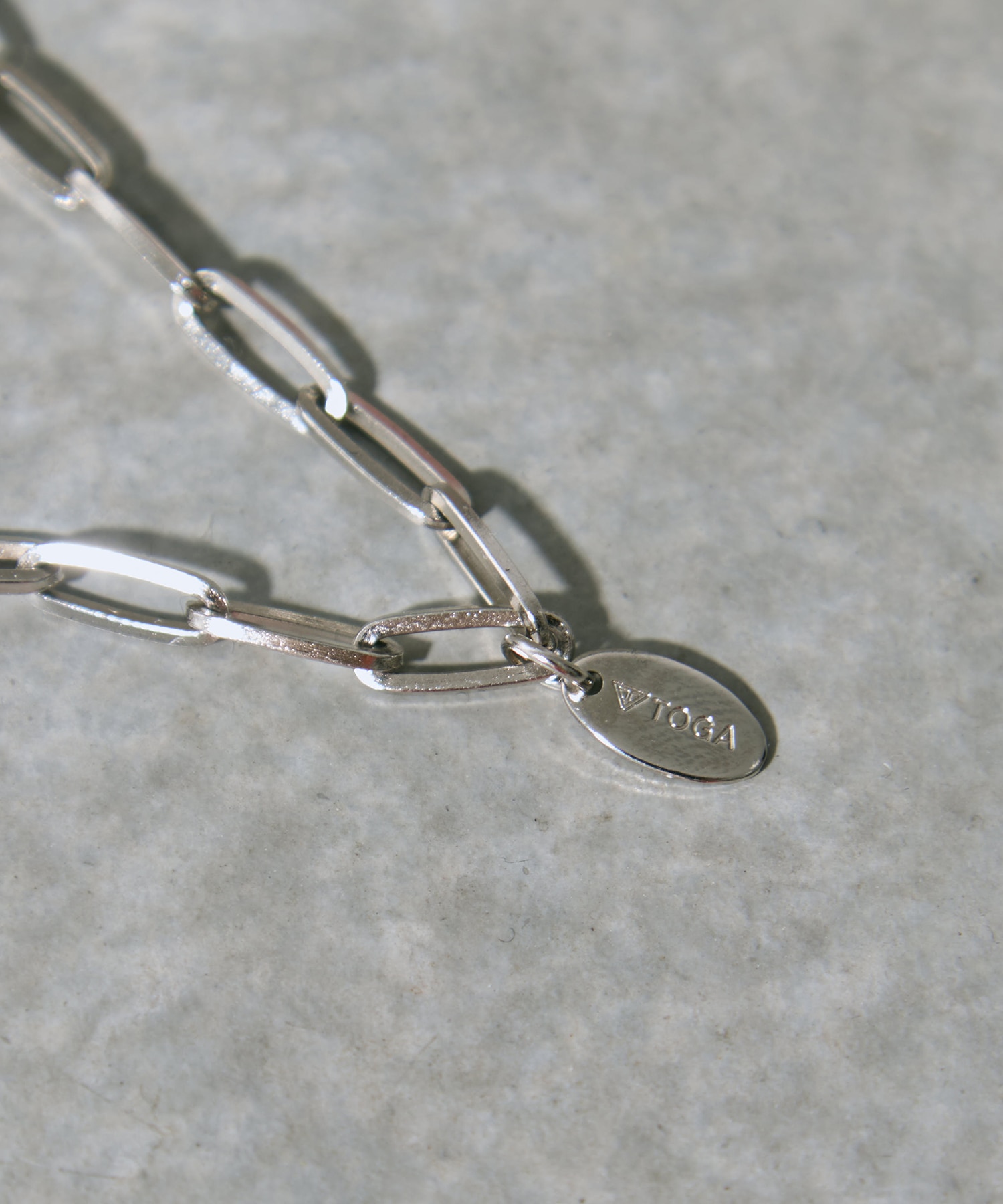 Metal motif loop tie TOGA