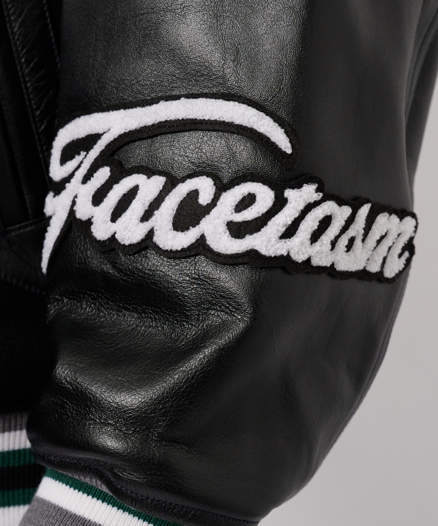 PATCHED STADIUM JACKET FACETASM