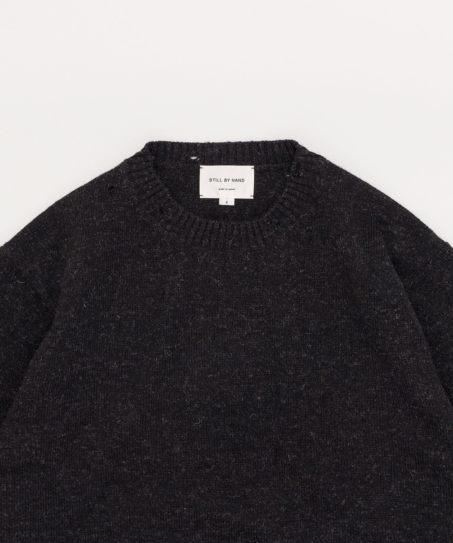 Punched shetland sweater STILL BY HAND