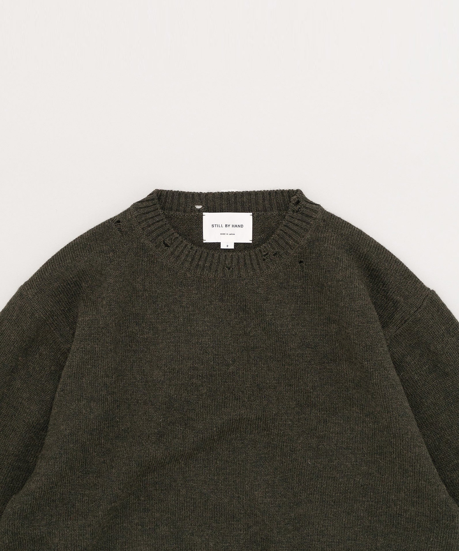 Punched shetland sweater STILL BY HAND