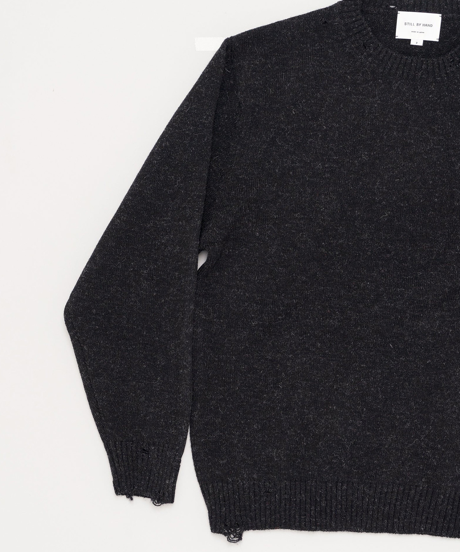 Punched shetland sweater STILL BY HAND