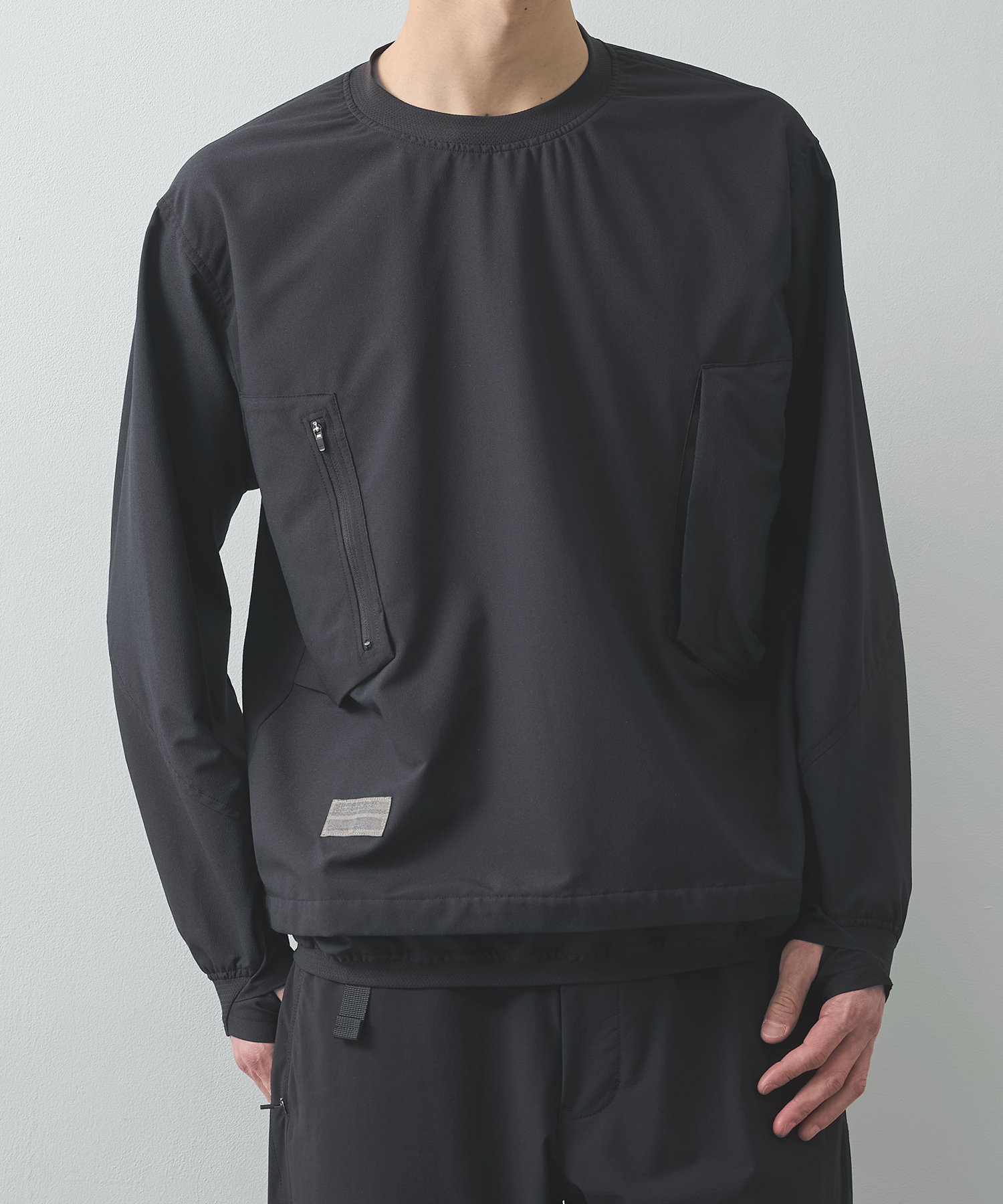 THE DEFORMED L/S PULLOVER WITH UTILITY POCKETS